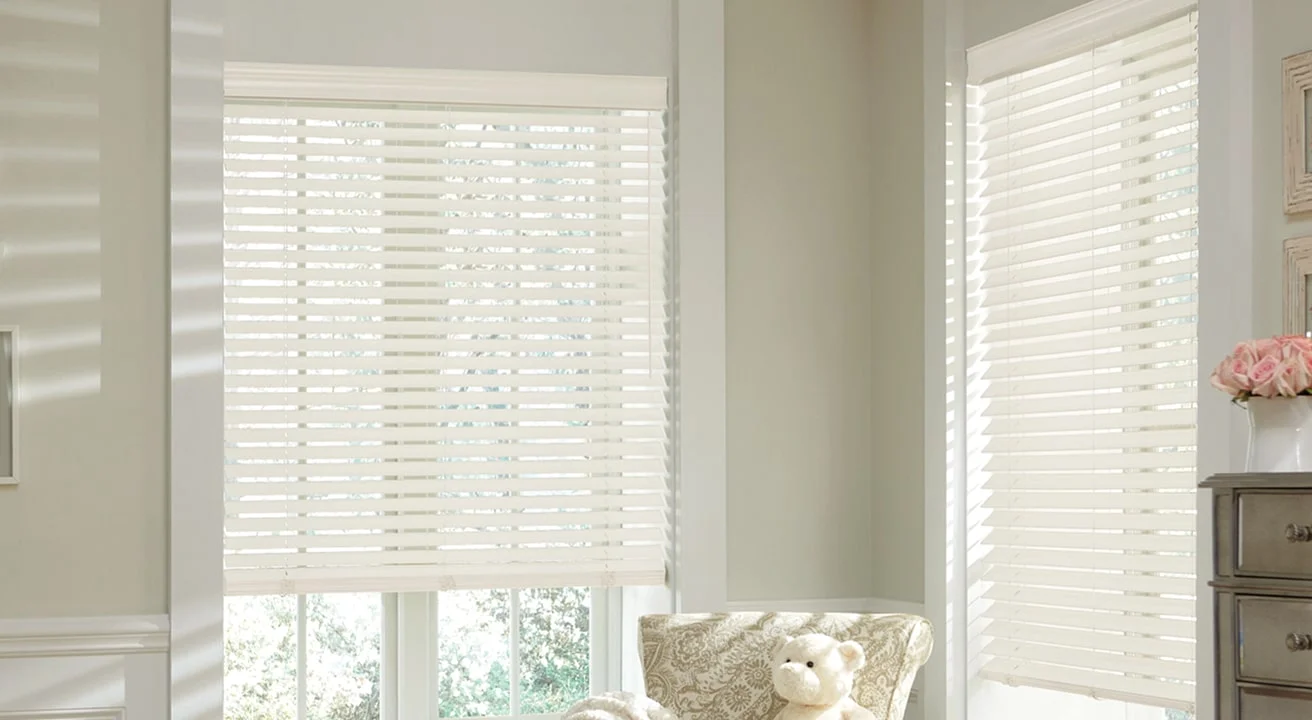Room with white blinds and teddy bear