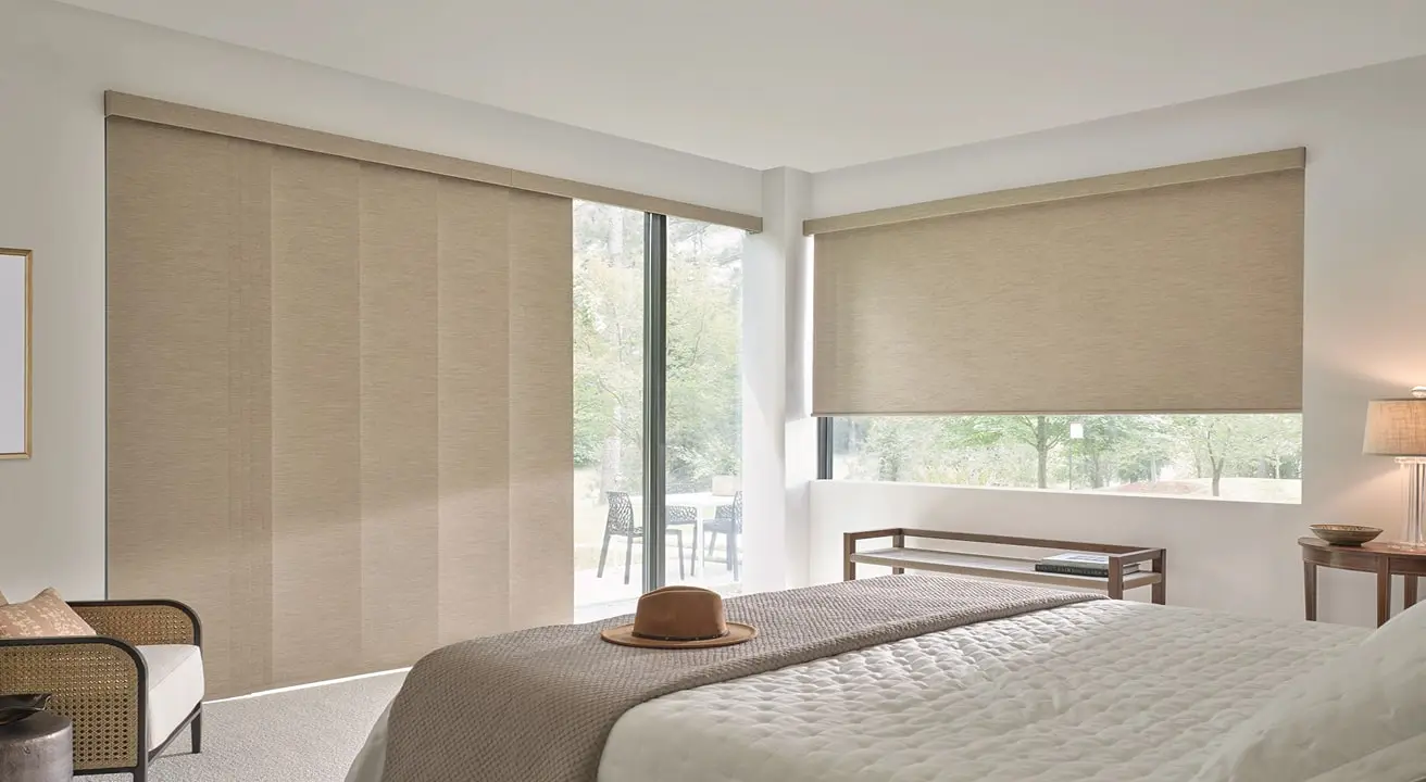 Modern bedroom with large windows and beige shades