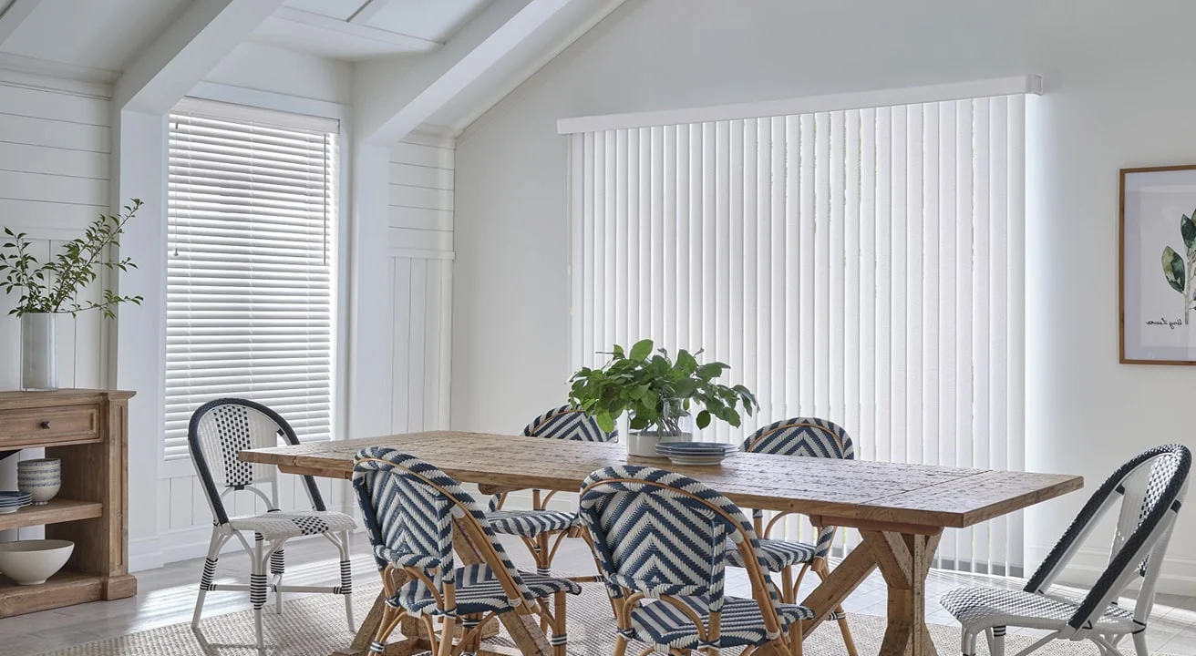 Dining room with table, chairs, and blinds