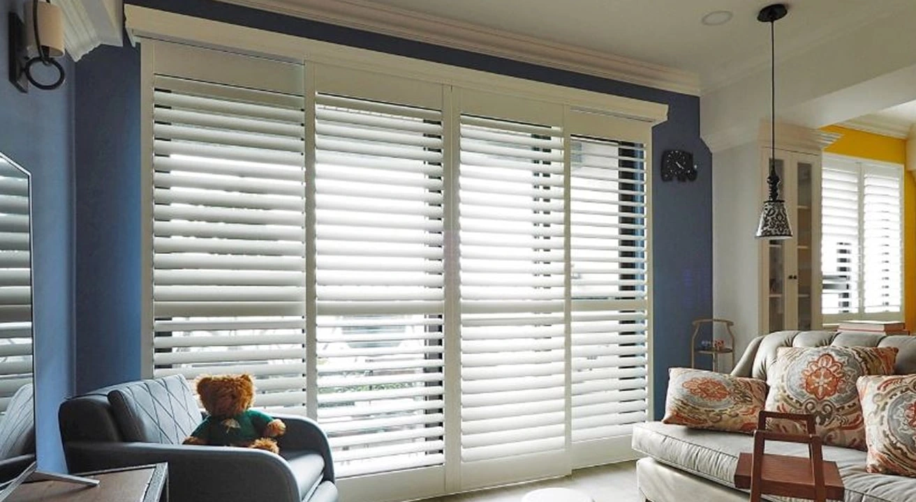 Living room with large windows and shutters