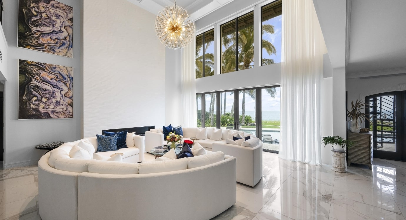 Spacious modern living room with large windows.