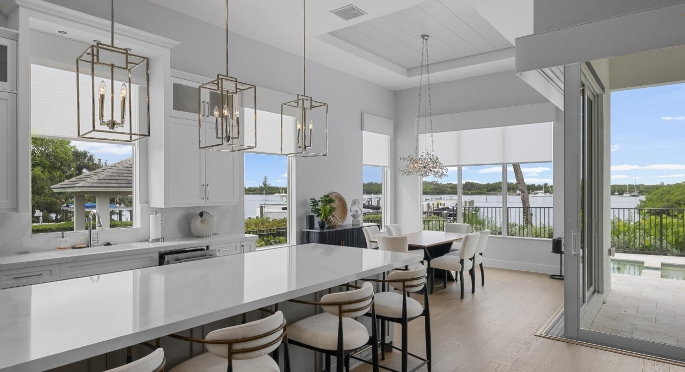 Modern kitchen with lake view and large island.