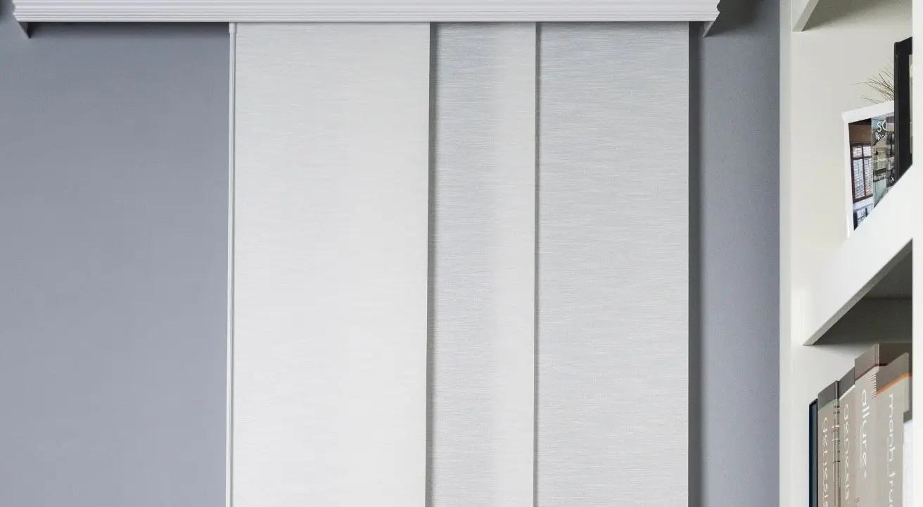 Modern gray panel track blinds in living room